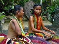 Young Ladies Talking While Weaving